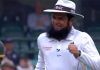 Cricket Records: Aleem Dar Umpire With Most ODIs Cricket umpire with a beard, wearing an ICC hat, smiling and celebrating during a match. The image captures his joyful reaction after making a significant decision, highlighting his role in setting cricket umpire records.