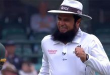 Cricket Records: Aleem Dar Umpire With Most ODIs Cricket umpire with a beard, wearing an ICC hat, smiling and celebrating during a match. The image captures his joyful reaction after making a significant decision, highlighting his role in setting cricket umpire records.